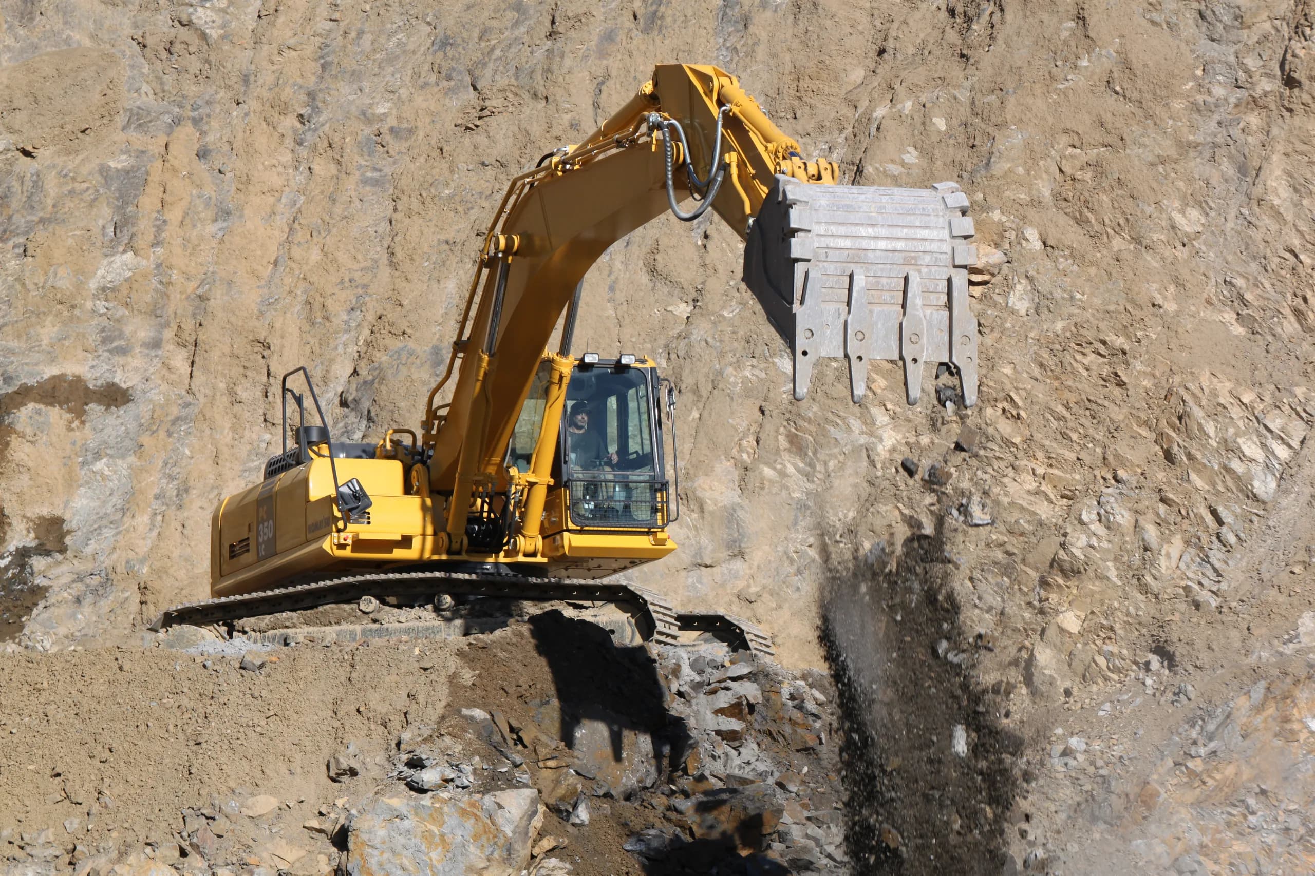 Excavator working the Pratt Quarry rock face, Kairanga
